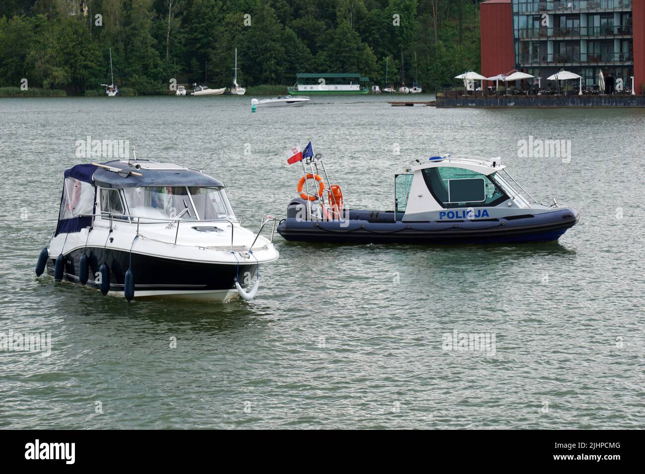 Mikolajki, Poland, July 20th, 2022 - Police controls small motorboat Stock Photo