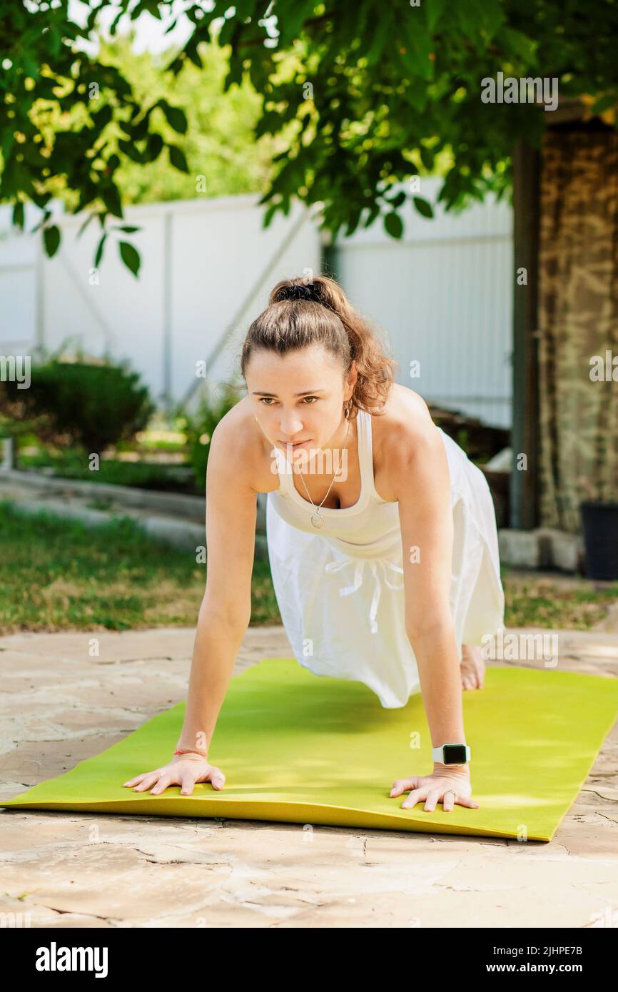 Premium Photo  Woman doing yoga asana utthita chaturanga dandasana (or  phalakasana)