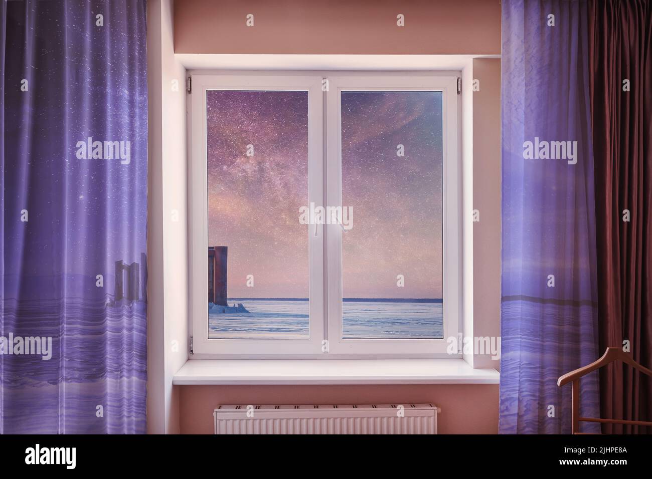 Surreal window in the living room with a fantastic space landscape in the window and on the curtains. Fantasy, imagination, future and dreams theme Stock Photo