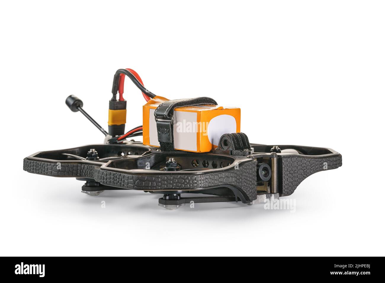Black FPV cinewhoop drone with battery front view with selective focus. Isolated on white, clipping path included Stock Photo