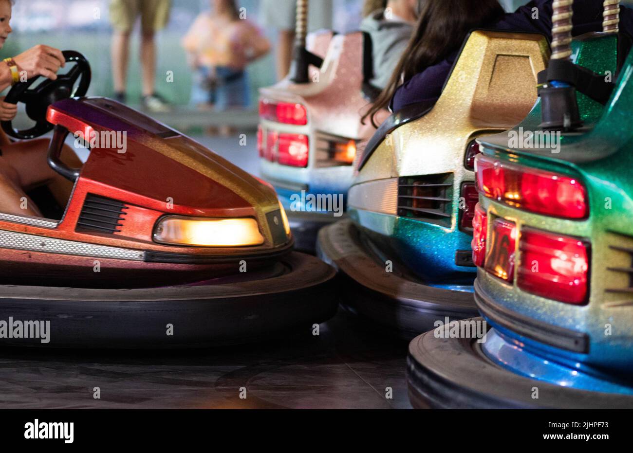 bumper cars close up people having fun Stock Photo Alamy