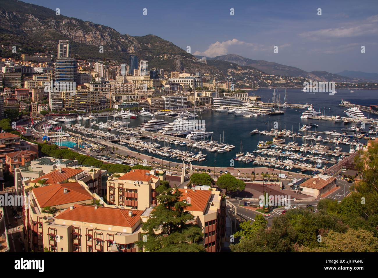 Panoramic aerial view of Monaco and Port Hercule, sweeping views of the city, mountains and harbor, luxury yachts and apartments in La Condamine Stock Photo