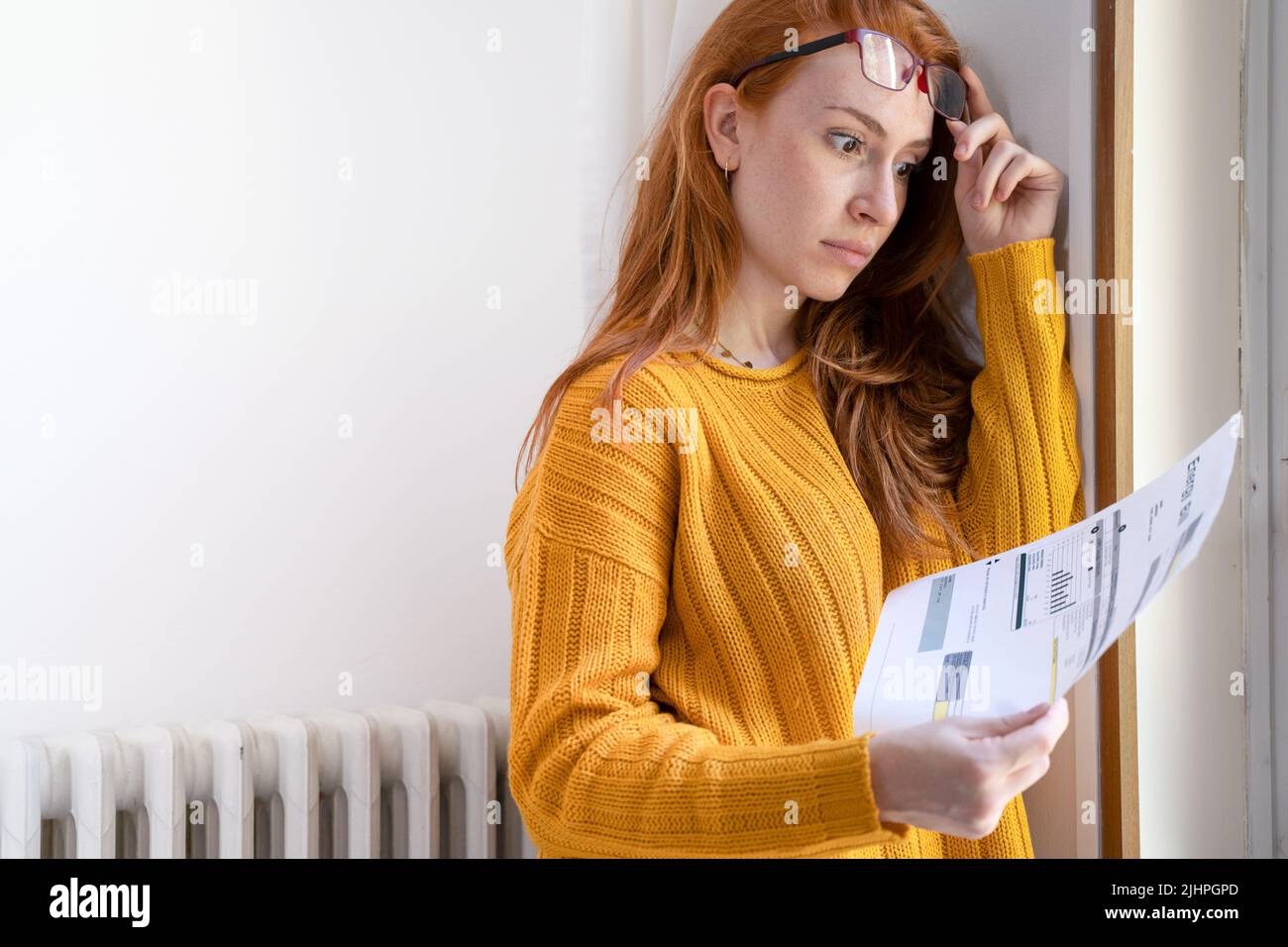 One person worried about energy bills cost having heating problem Stock Photo