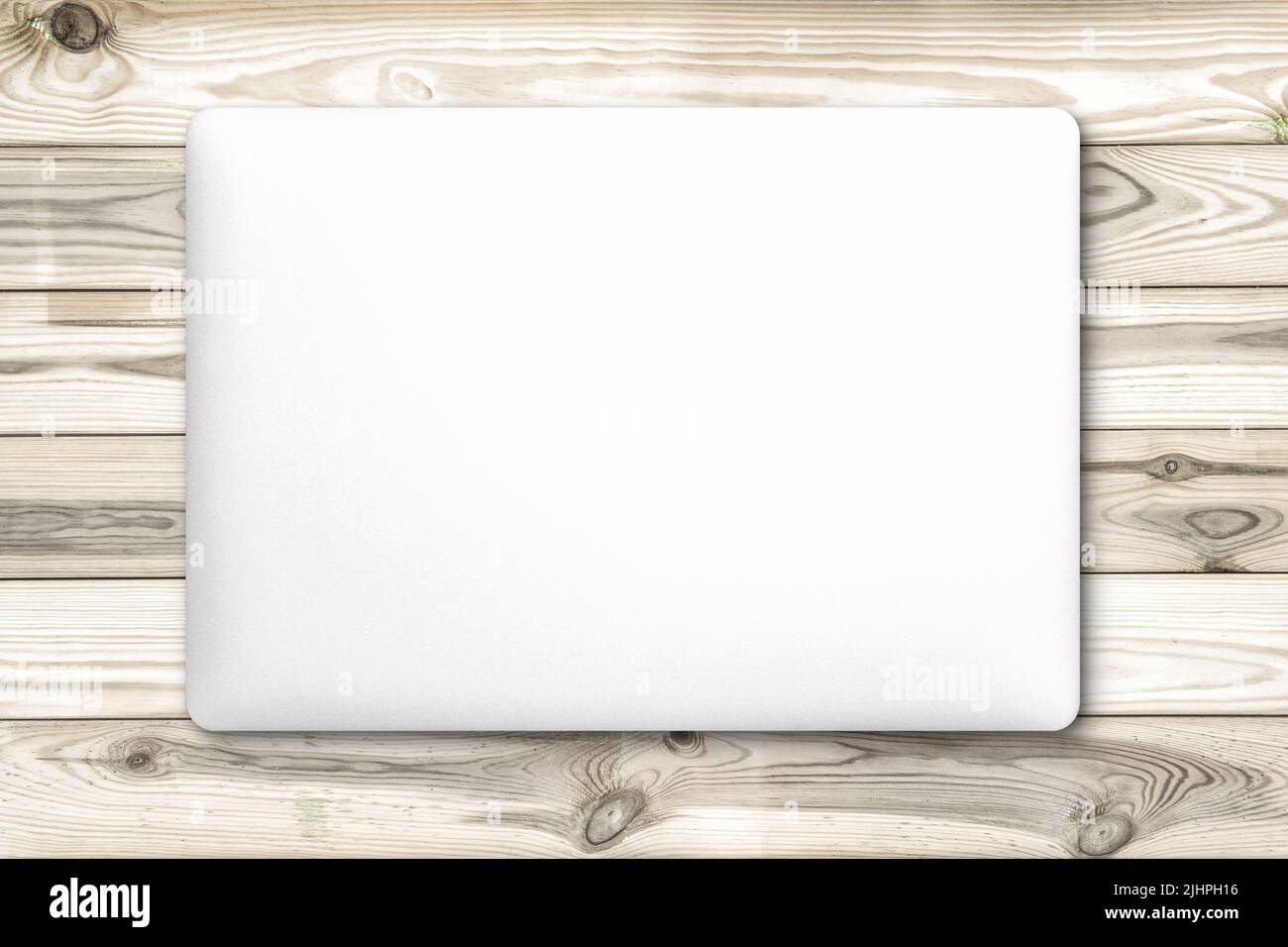 Laptop mock up on wooden background. Office workspace flat lay Stock Photo