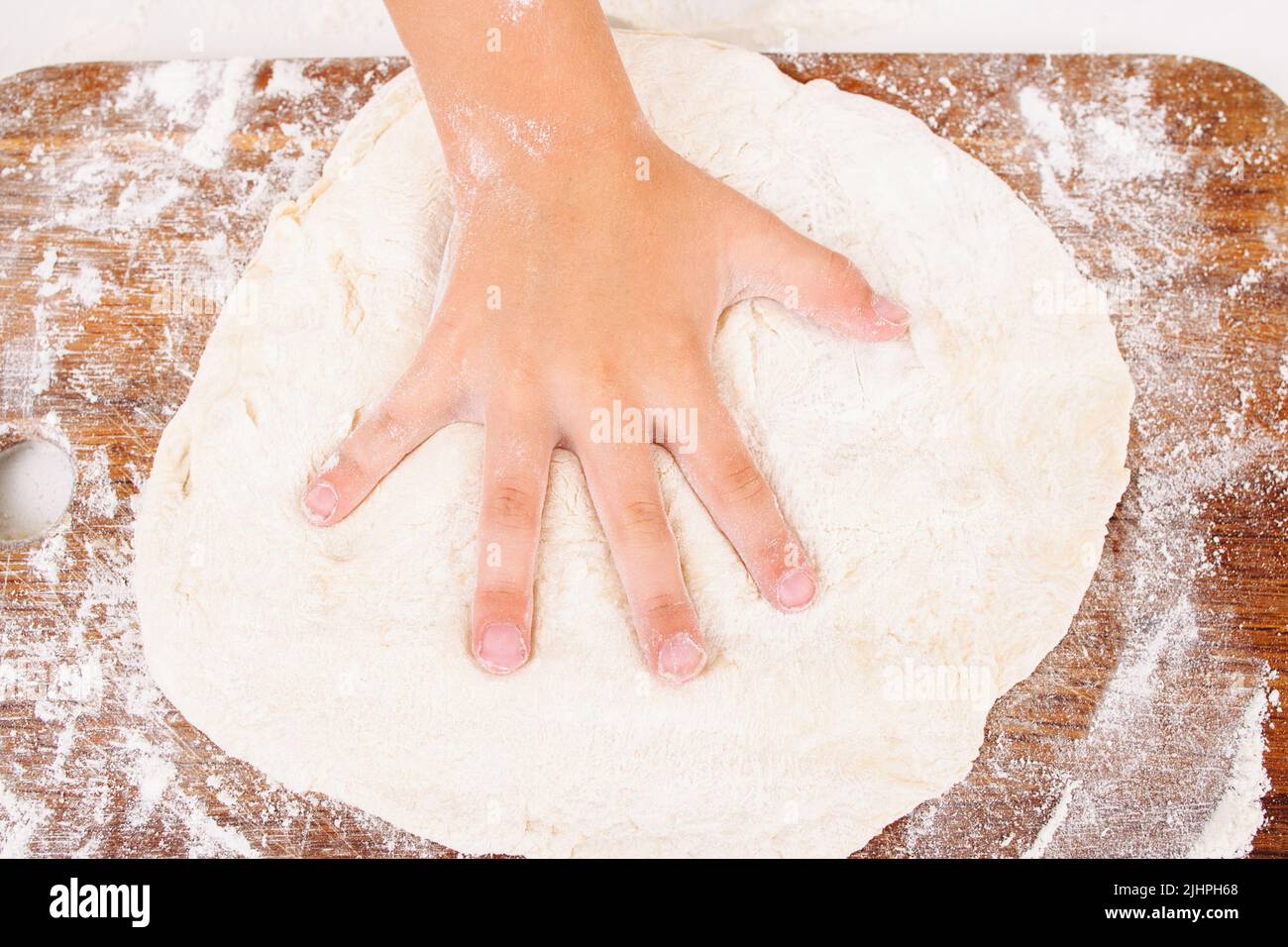 Kid making handprint on raw dough closeup Stock Photo Alamy