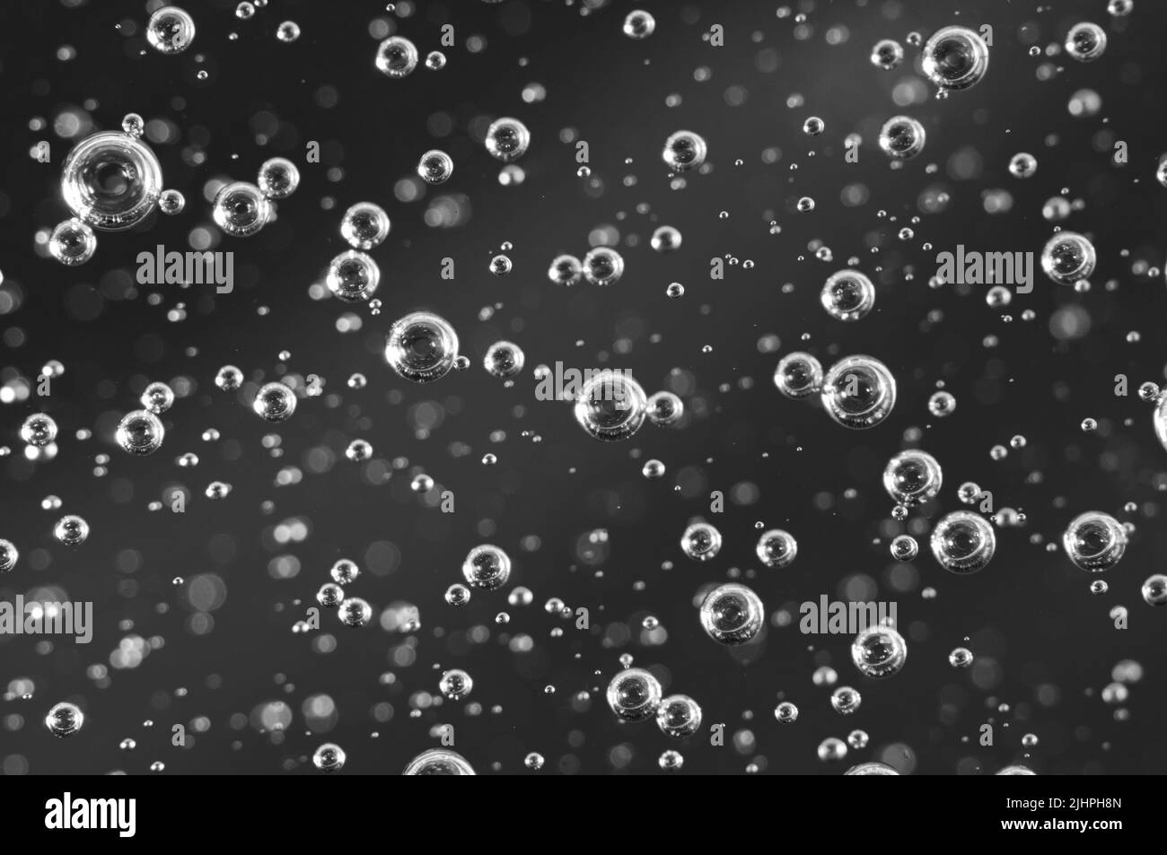 Dark oil with bubbles. Bubbles in liquid. Black and white. Oil concept. Oil business concept and petrol production Stock Photo