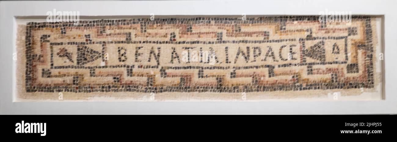 A Roman epigraphical funeral mosiac at the Archeological Museum of Sousse in Tunisia. The name of the deceased (Benatia) is followed wityh the words ' Stock Photo