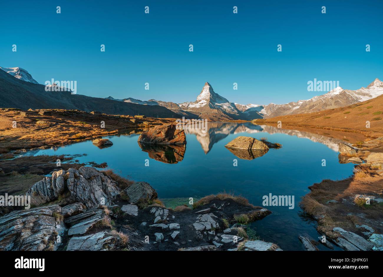 Panoramic Morning View Of Lake Stellisee With The Matterhorn Cervino 