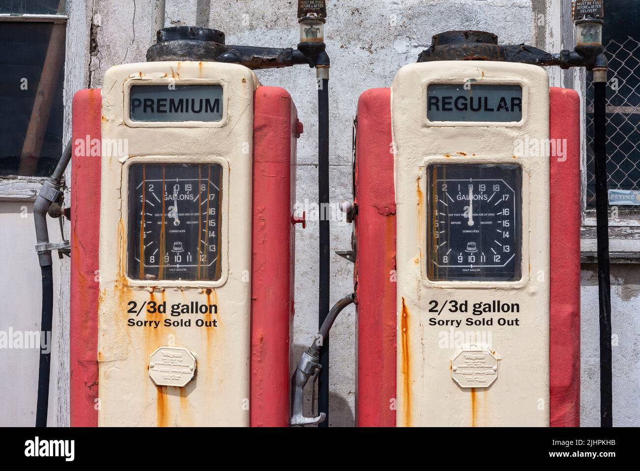 Oldfashioned petrol pumps still stand by the roadside in the centre of