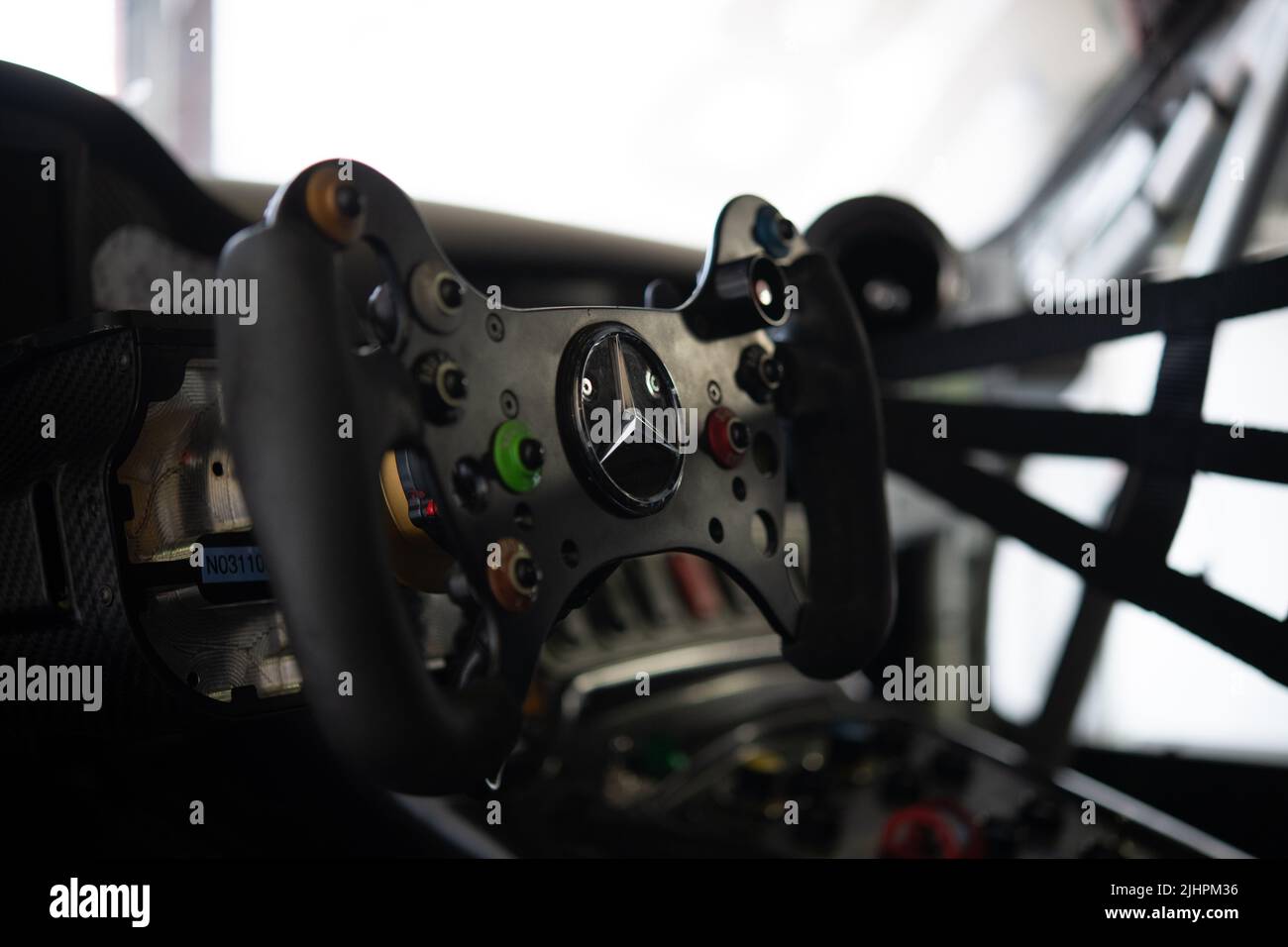 Car racing steering wheel close up in Mercedes AMG GT car cockpit. Imola, Italy, june 19 2022. DTM Stock Photo