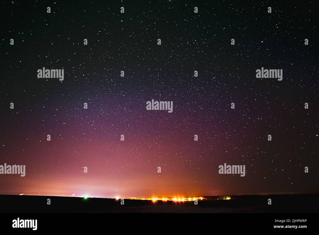 Beautiful Colorful Night Sky Glowing Stars Background Backdrop With Gradient. Sunset Sunrise Lights And Night Starry Sky In Yellow Pink Purple Colors Stock Photo