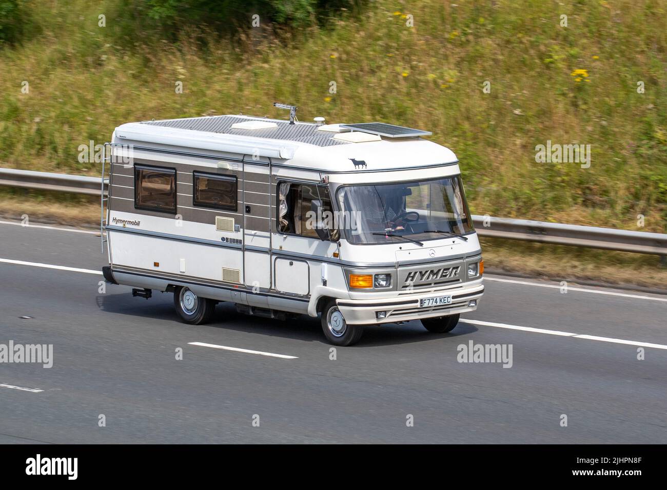 1989 80s eighties Mercedes Benz 308 D 308DF Chasis Cab 2300 cc Hymer Hymermobil motorhome; travelling on the M6 Motorway, Manchester, UK Stock Photo