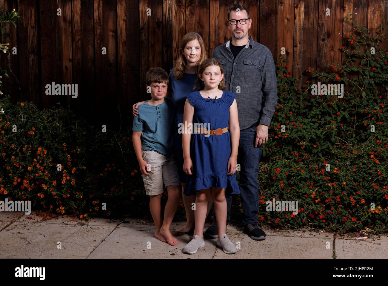 Cancer survivor Grace Bumstead poses for a picture with her brother Luke and parents Melissa and Chad in the back yard of their home in West Hills, California, U.S., June 22, 2022.      REUTERS/Mike Blake Stock Photo