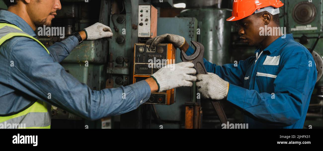mechanical engineer team maintain and check machine in factory industry Stock Photo