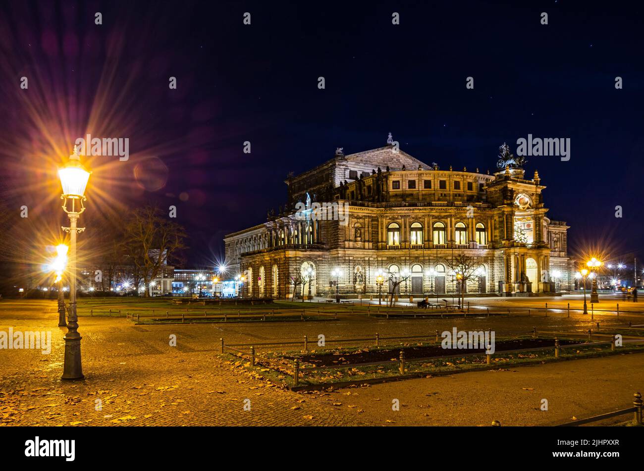 The illuminated world-famous Semper Opera House at night, Theater Square in Dresden, Saxony, Germany. Stock Photo