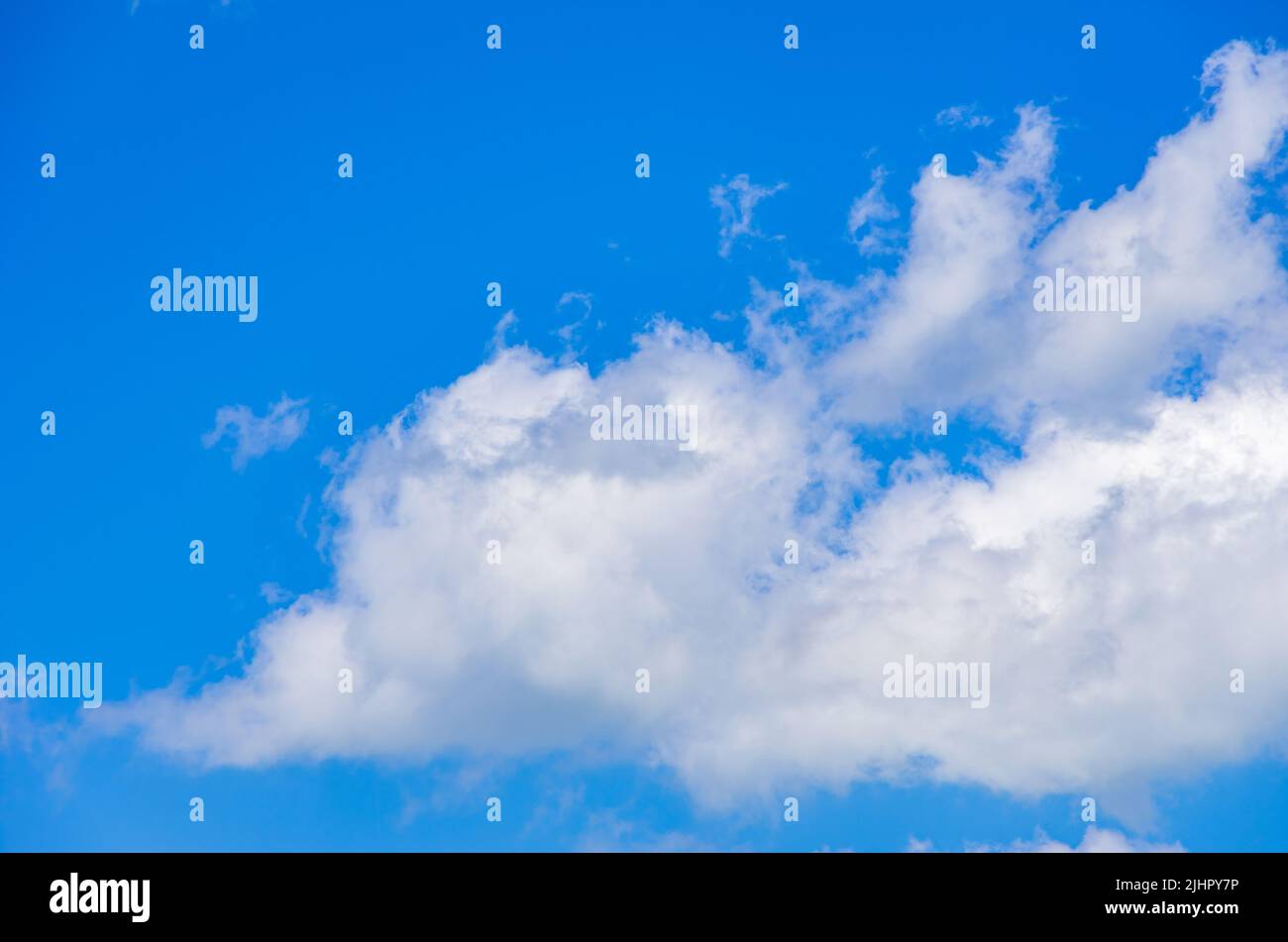 Background of cloud formations against a blue sky. Stock Photo