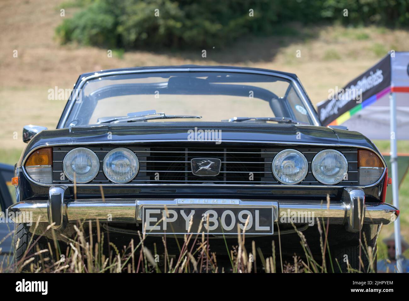 Front View Of A Black Convertible Triumph Stag From The 1970s In The 
