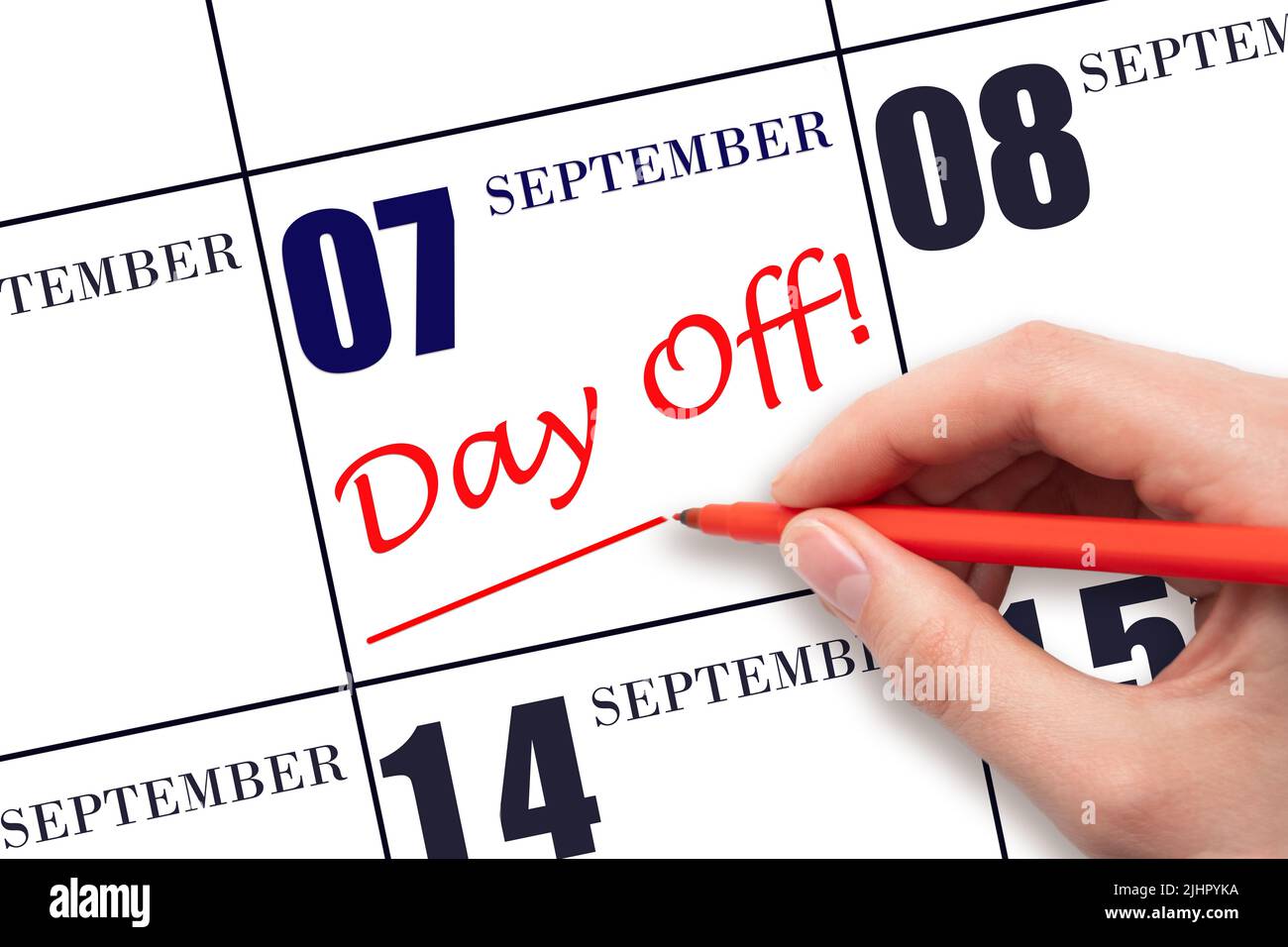 7th day of September. Hand writing text DAY OFF and drawing a line on calendar date 7 September . Vacation planning concept. Autumn month, day of the Stock Photo