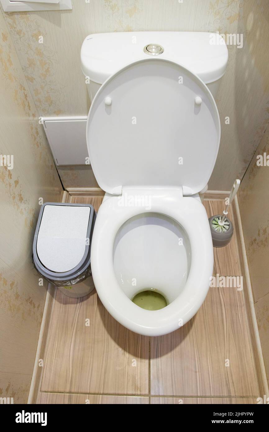 White toilet bowl in a bathroom Stock Photo - Alamy