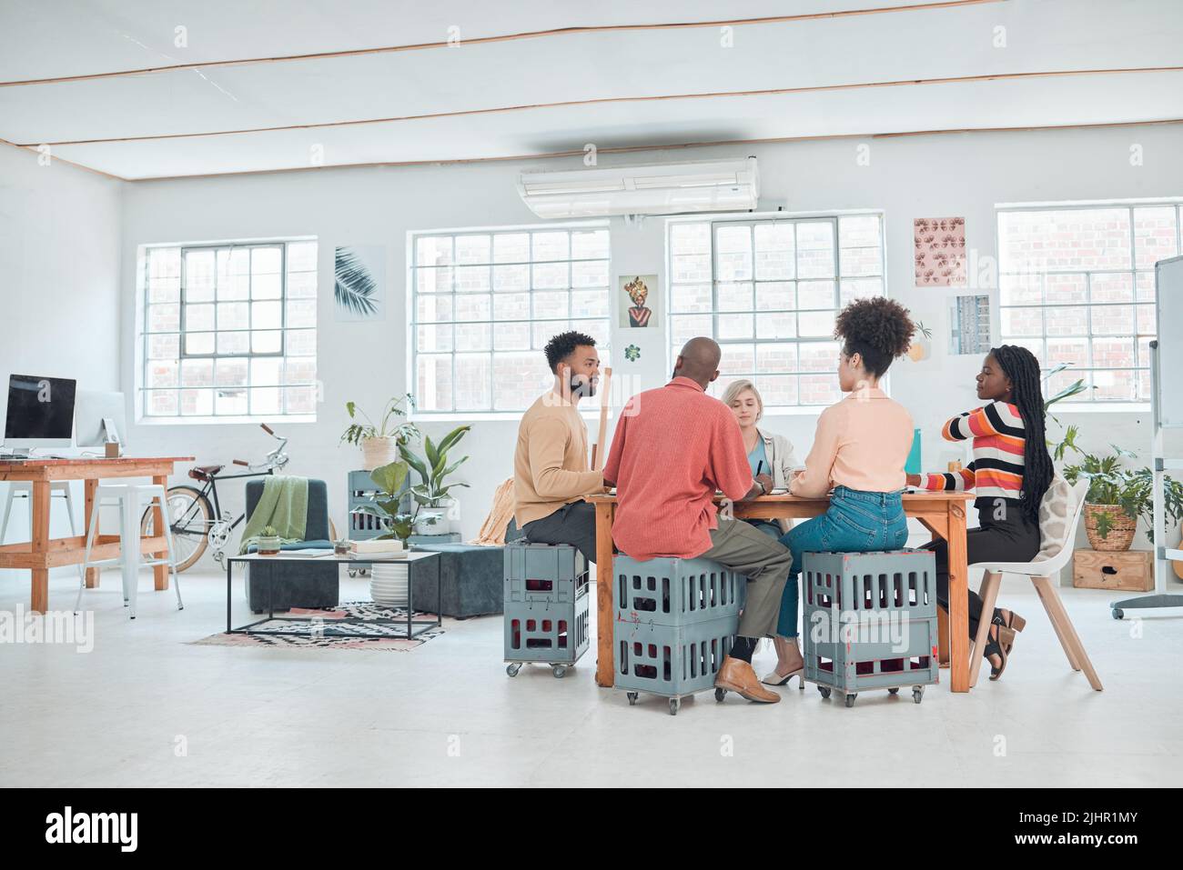 Group of happy diverse businesspeople having a meeting in a modern ...