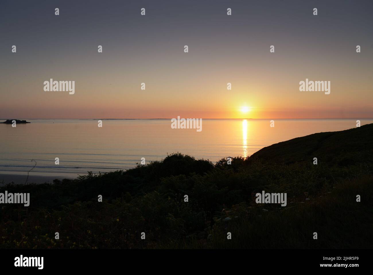France, Bretagne region (Brittany), North tip of Finistère, pays d'Iroise, Ploumoguer, beach of Illlien, sunset, view over the Île d'Ouessant, Stock Photo
