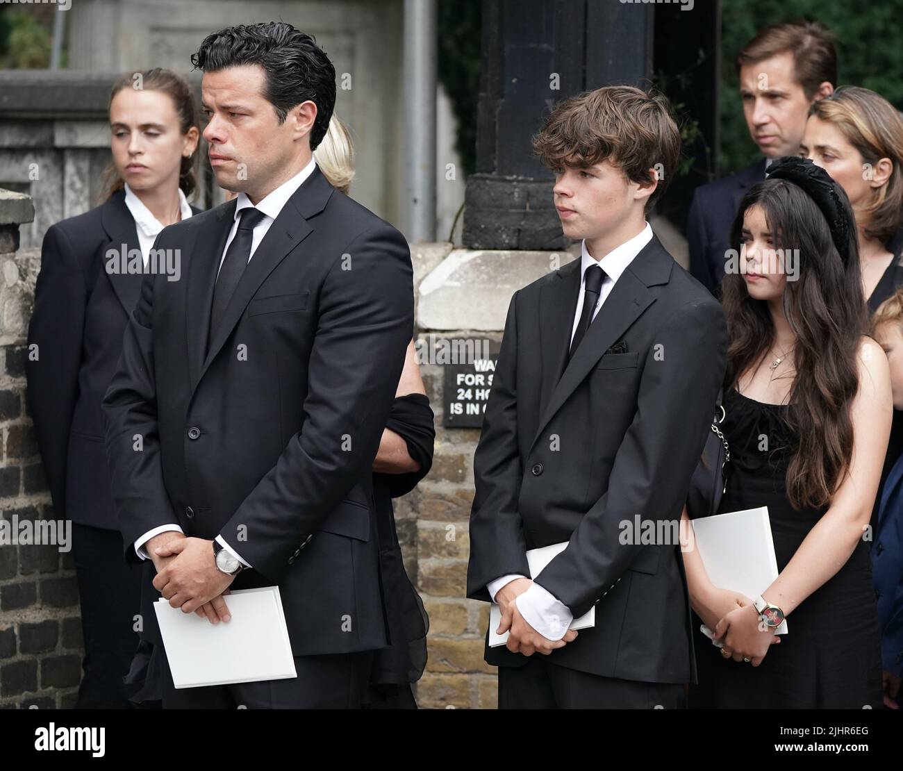 The family of Dame Deborah James, (left to right) husband Sebastien Bowen, son Hugo Bowen, and daughter Eloise Bowen, leaving her funeral service at St Mary's Church in Barnes, west London. Picture date: Wednesday July 20, 2022. Stock Photo