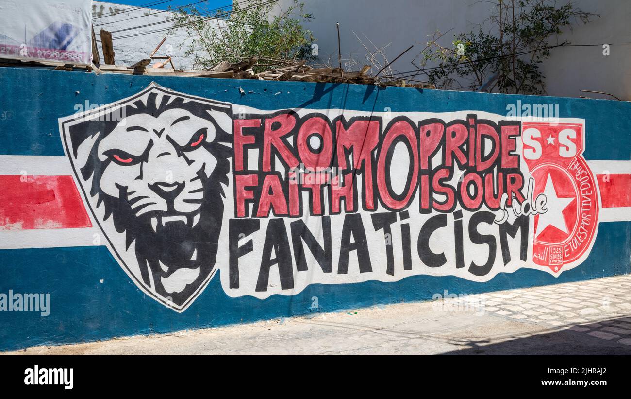 Graffiti on a wall in the ancient Sousse Medina in Tunisia supporting the local football (soccer) team Étoile Sportive du Sahel. Stock Photo