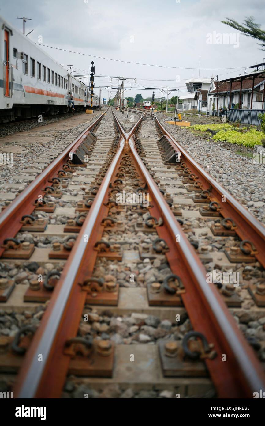 Railway station with passanger train in java Indonesia Stock Photo - Alamy
