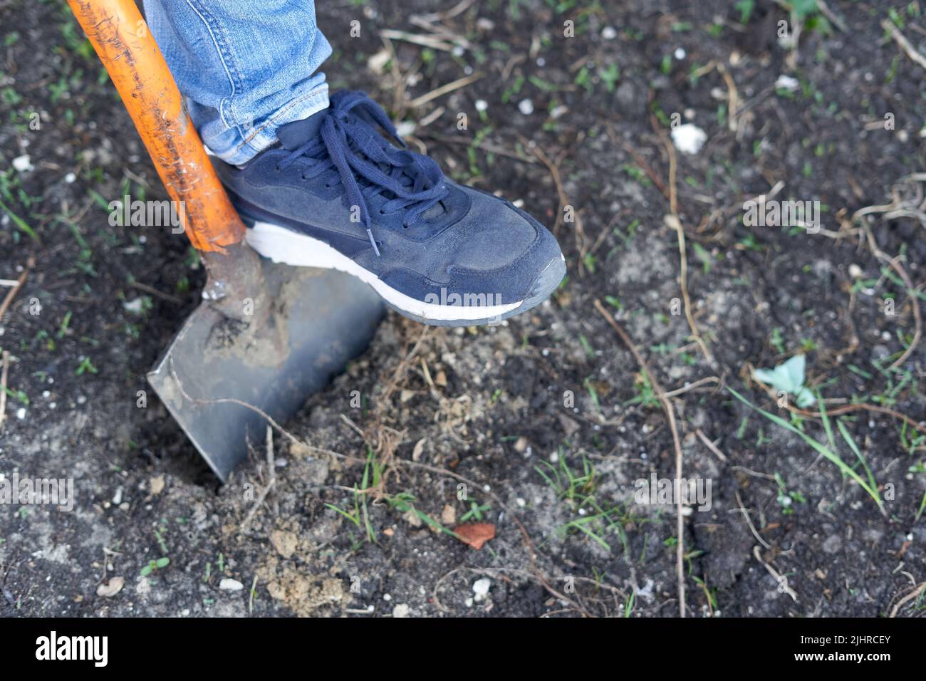 Top view of a person ploughing the land Stock Photo