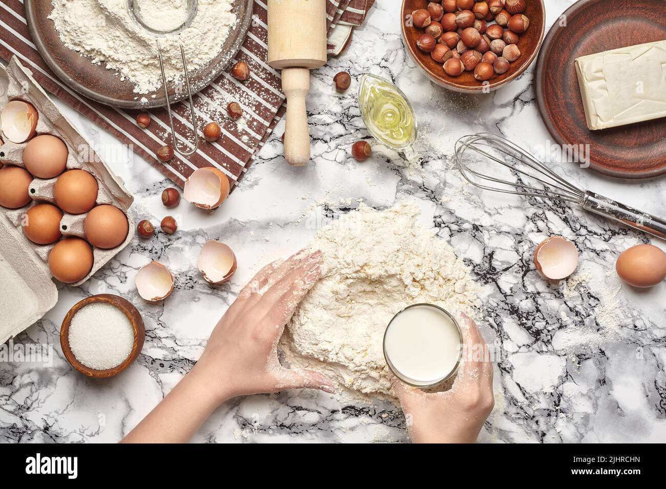 Closeup shot. Top view of a baker cook place, hands are working with a