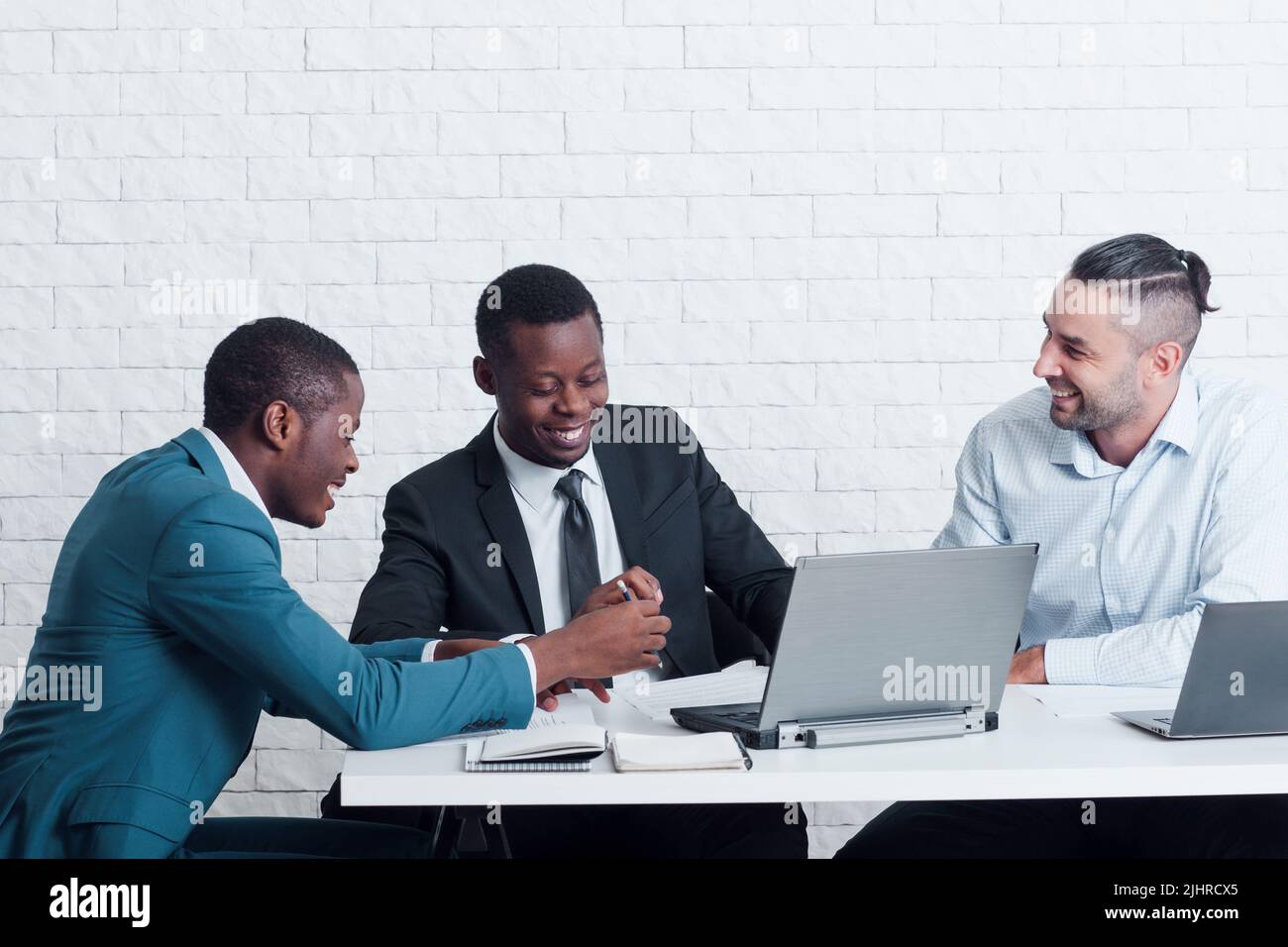 Lazy workers chatting in office. Bad discipline. Stock Photo