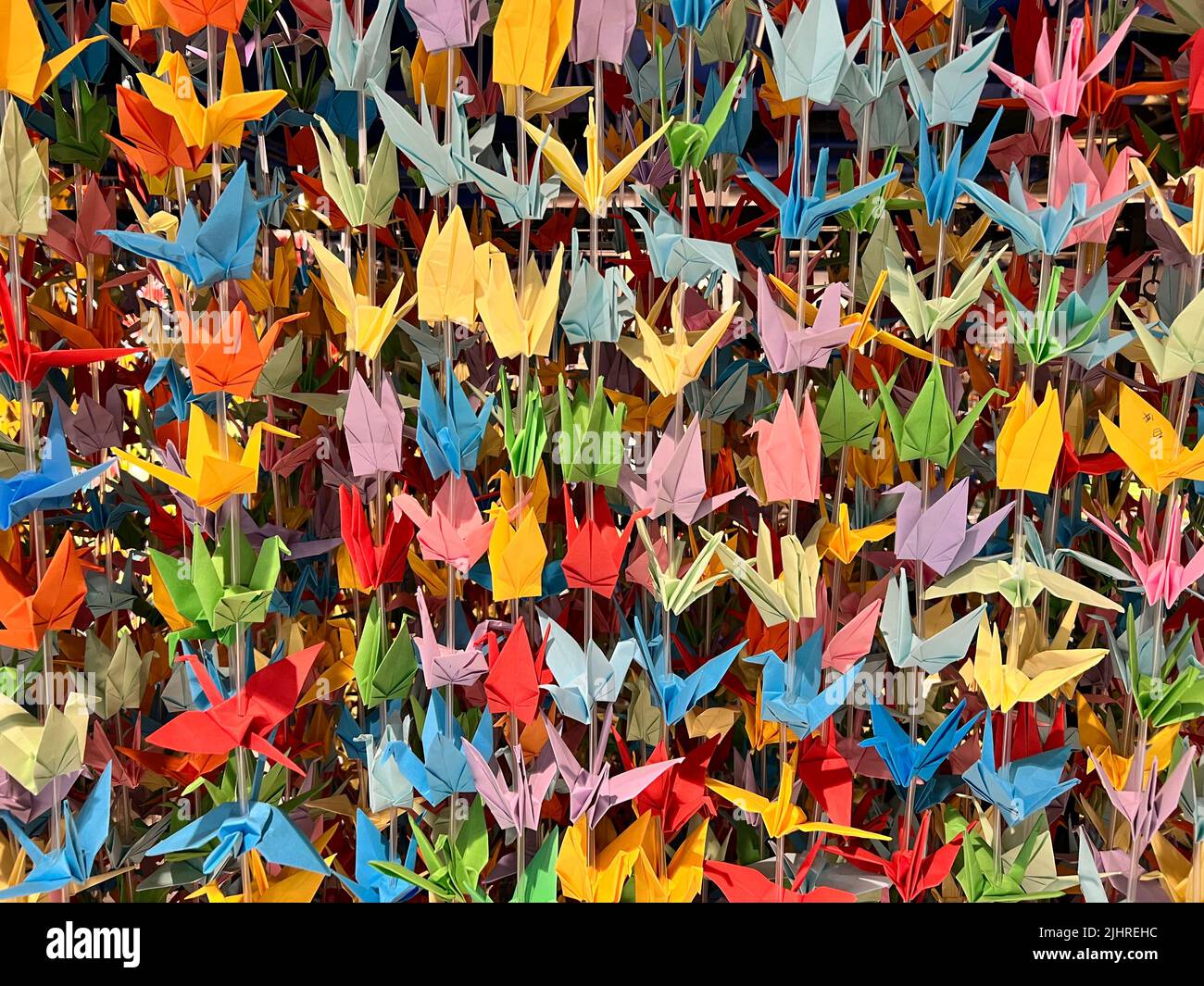thousand of paper crane or japnaese paper orizuru background, a blessing culture in Japan Stock Photo