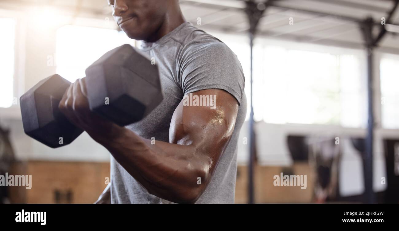 Muscled Arm Lifting Weights Stock Image - Image of active