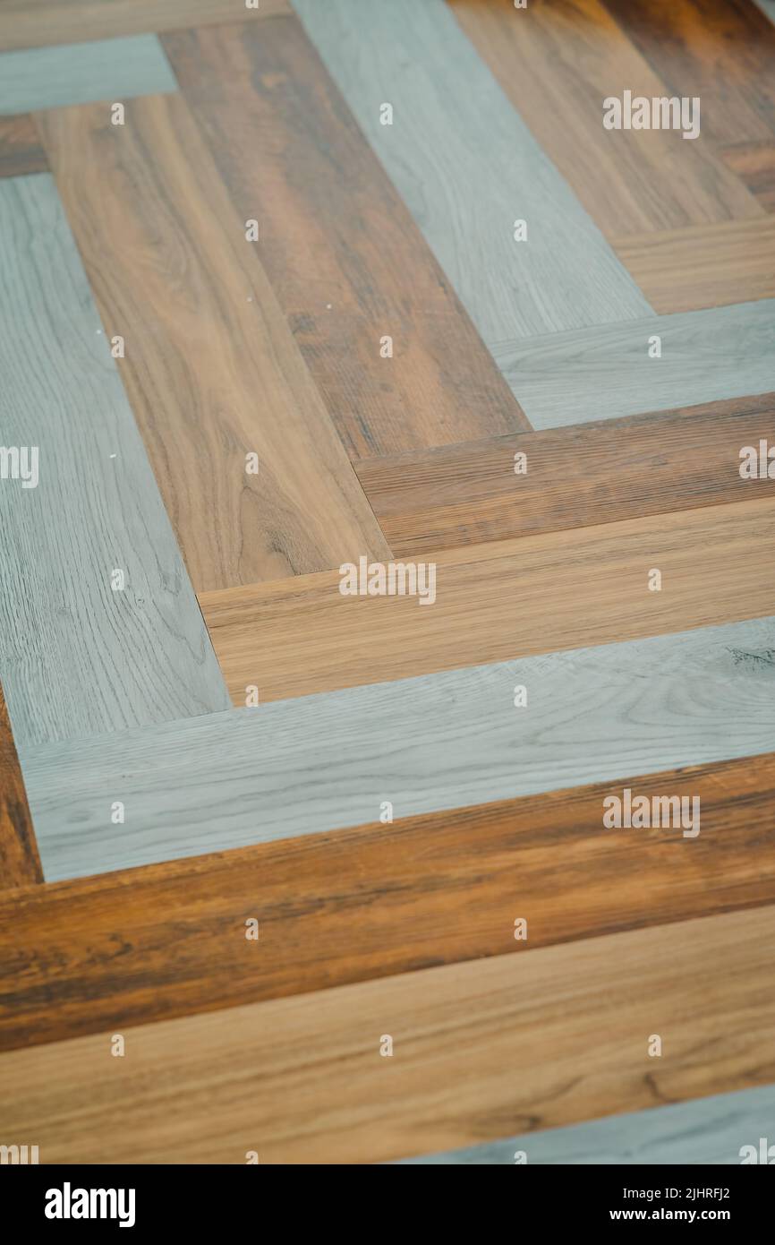 Herringbone PVC flooring with decoration. Multicoloured luxury design
