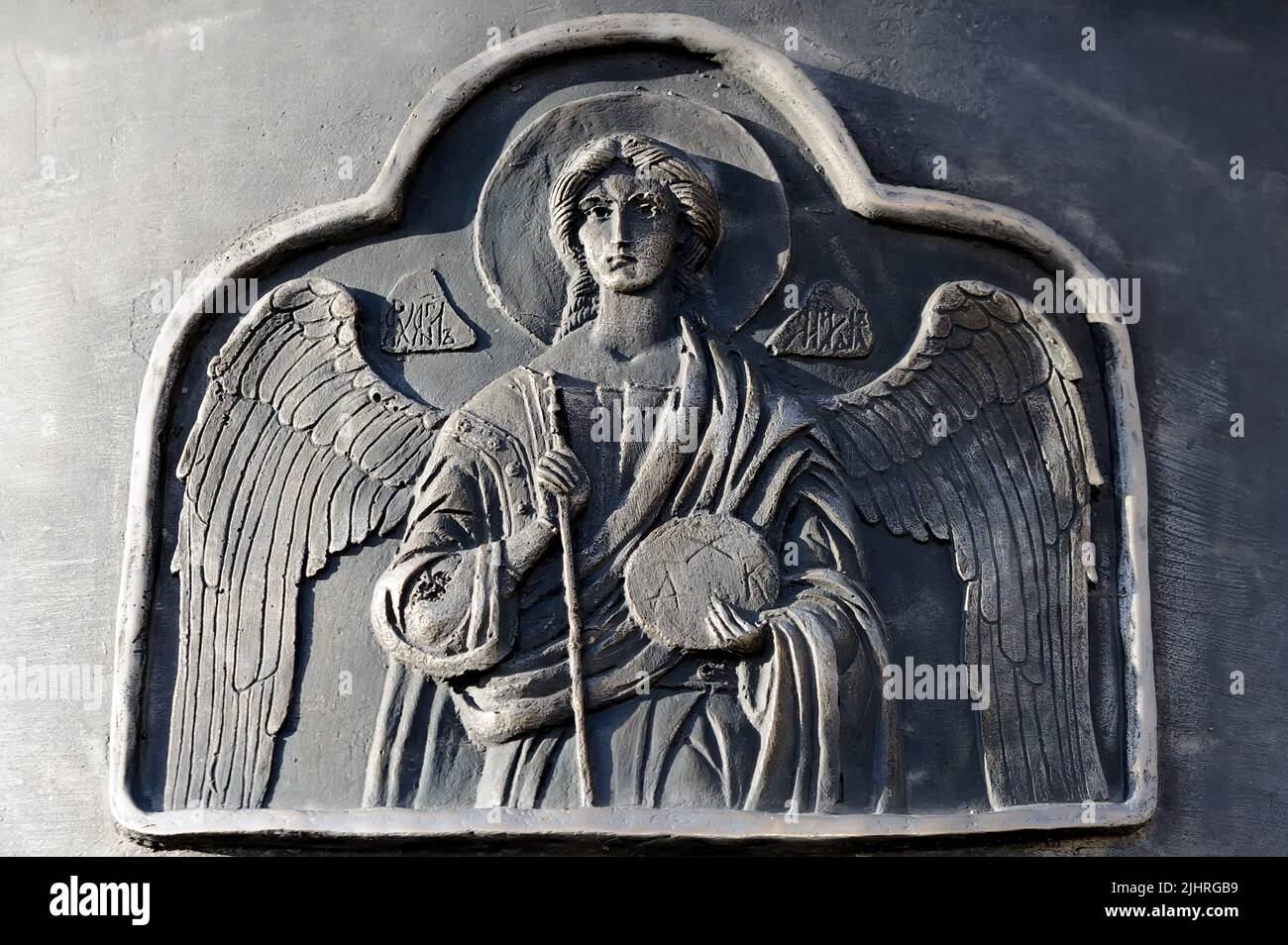 Relieving Angel Angel relief on the metal surface Stock Photo - Alamy