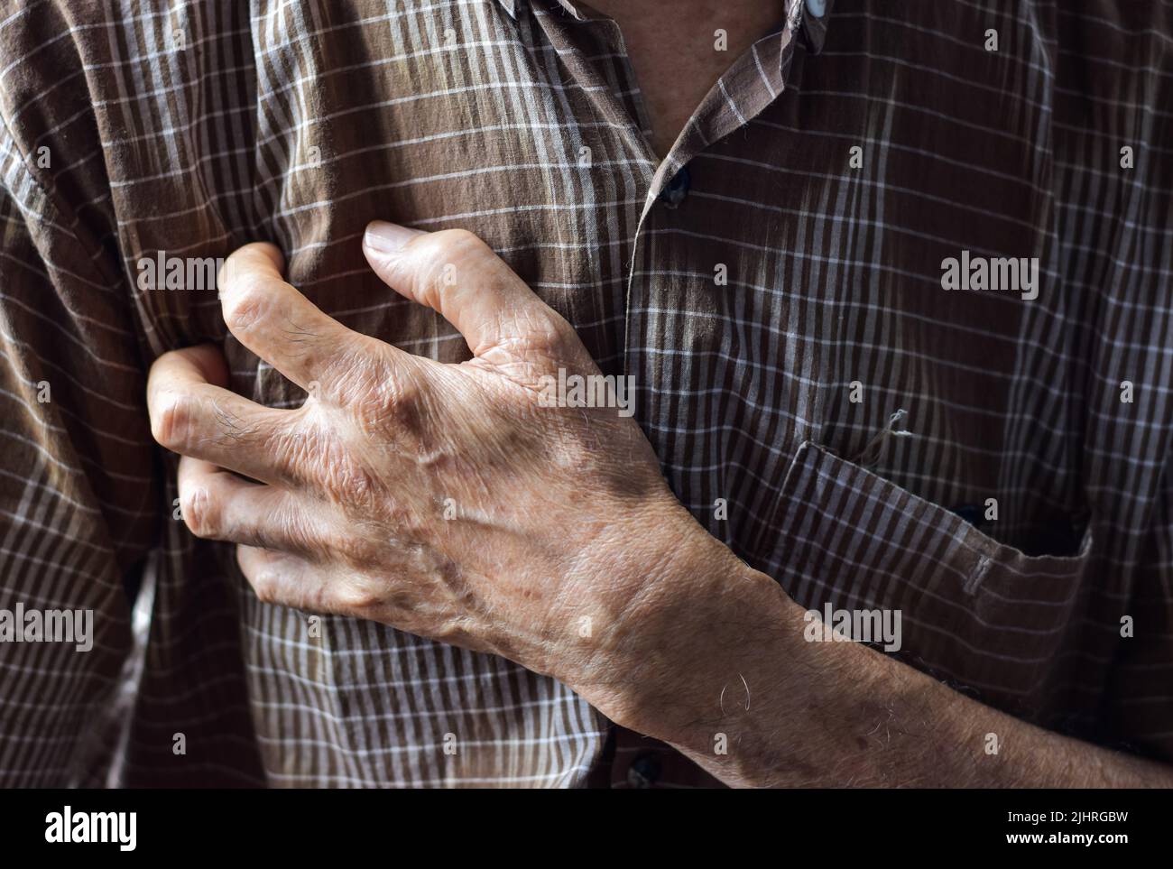 Asian elder man suffering from right sided chest pain. Chest pain can