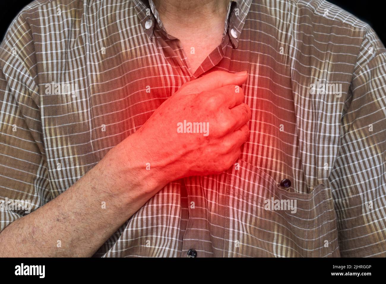 Asian elder man suffering from central chest pain. Chest pain can be