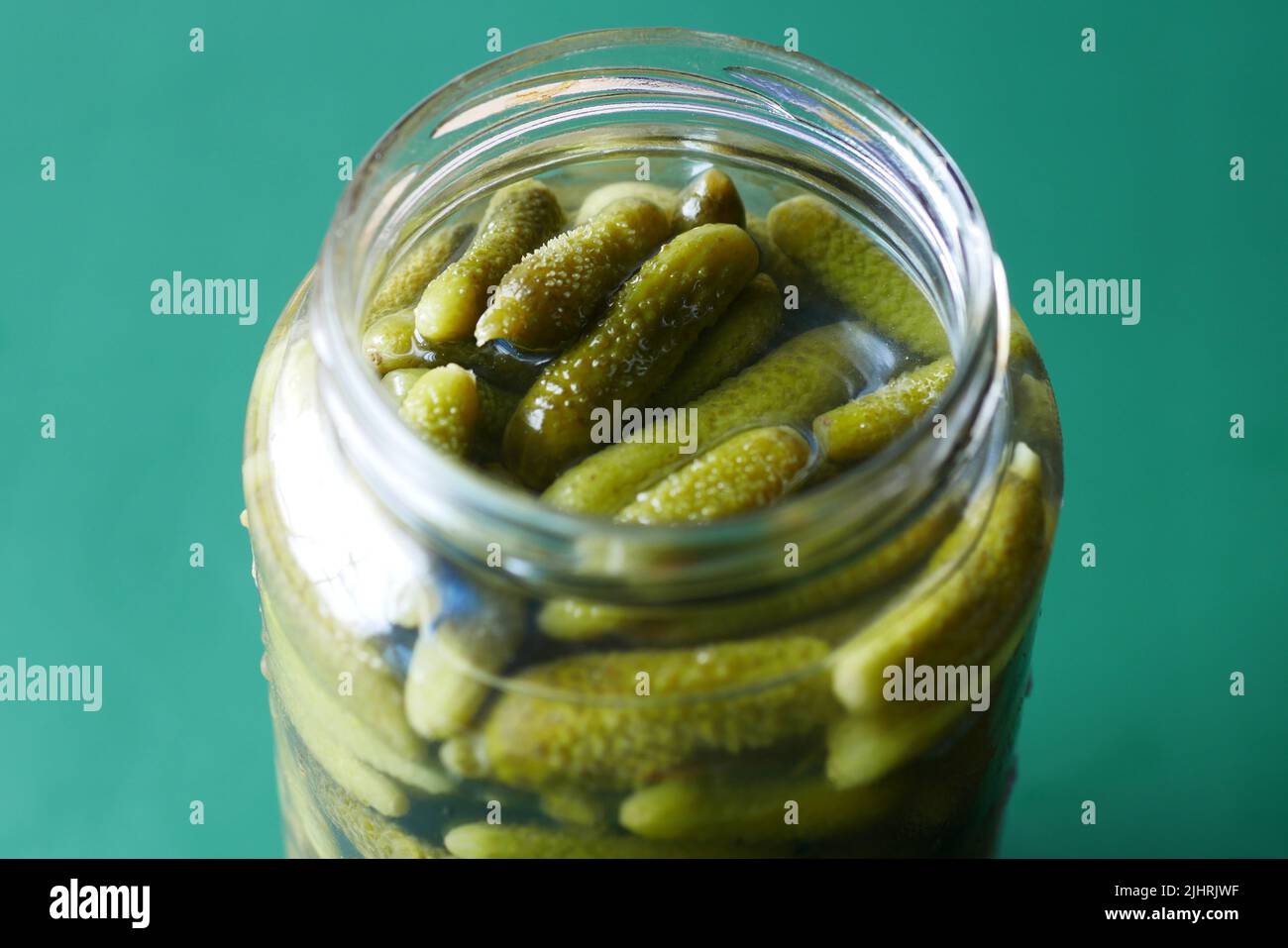 bottle of pickled cucumbers, pickles on table Stock Photo Alamy