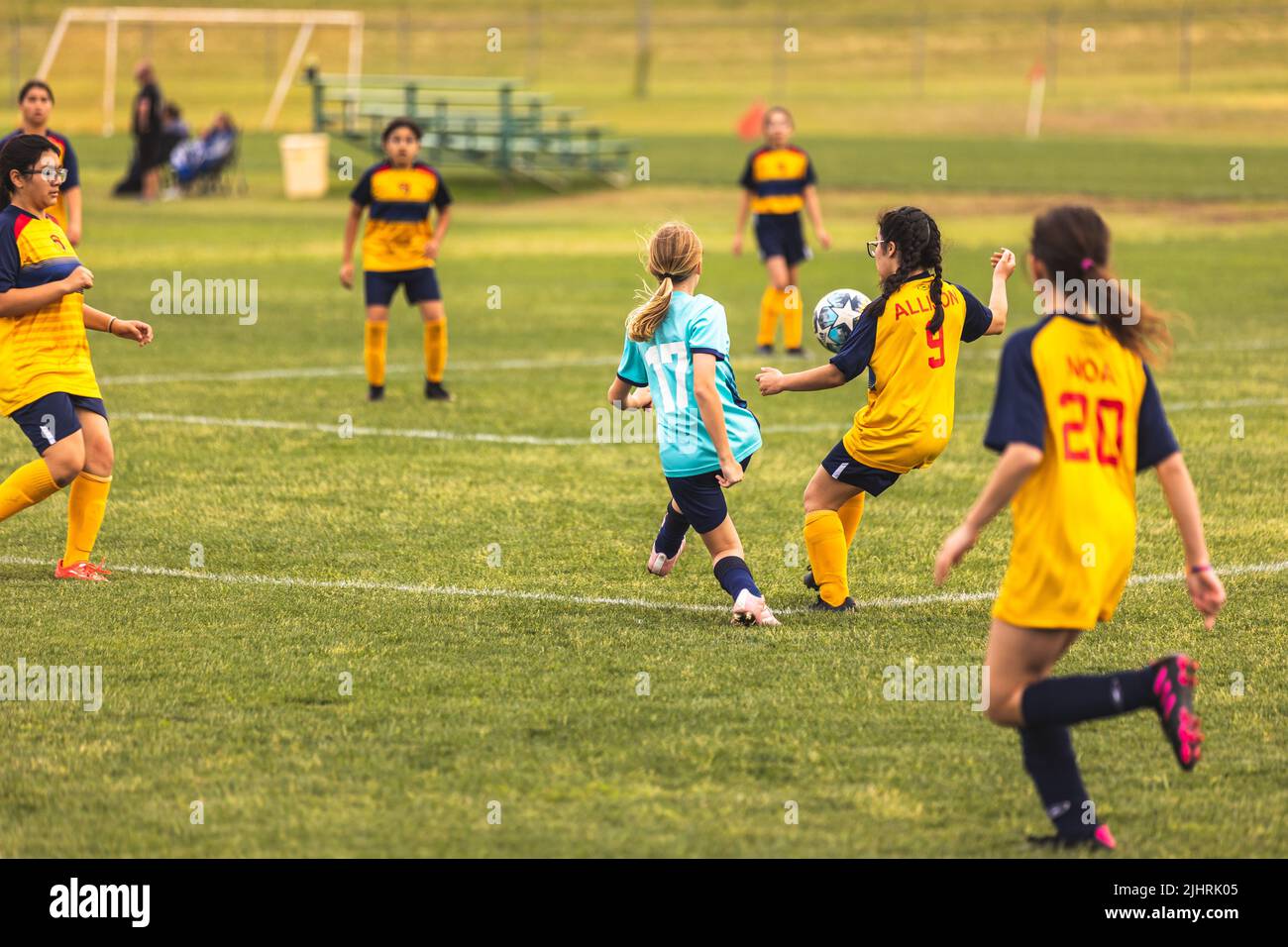 The young girls playing soccer at Youth Soccer Game Stock Photo Alamy