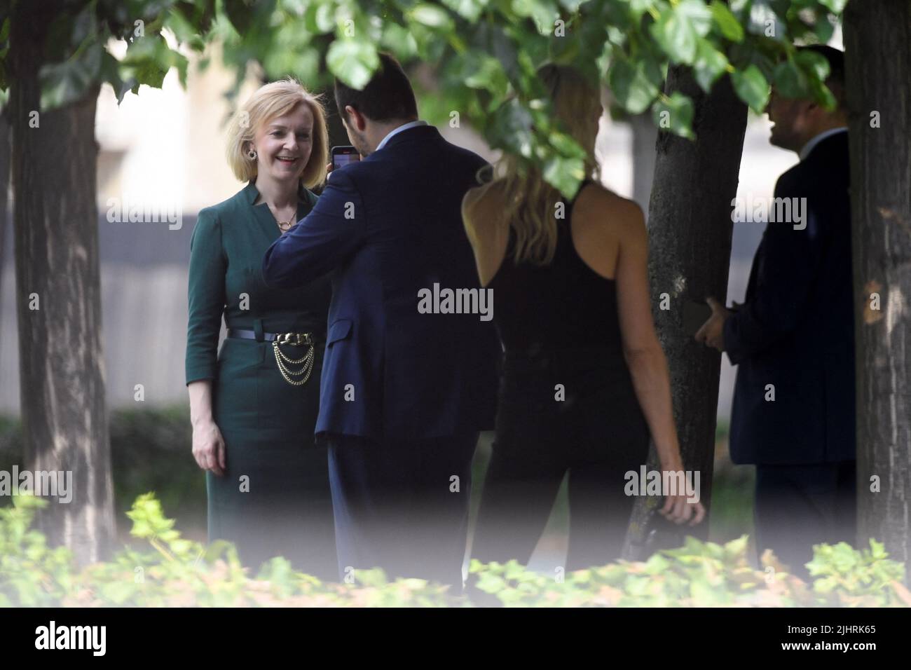 British Foreign Secretary and Conservative leadership candidate Liz Truss speaks with members of her team near the houses of Parliament, in London, Britain, July 20, 2022. REUTERS/Toby Melville Stock Photo