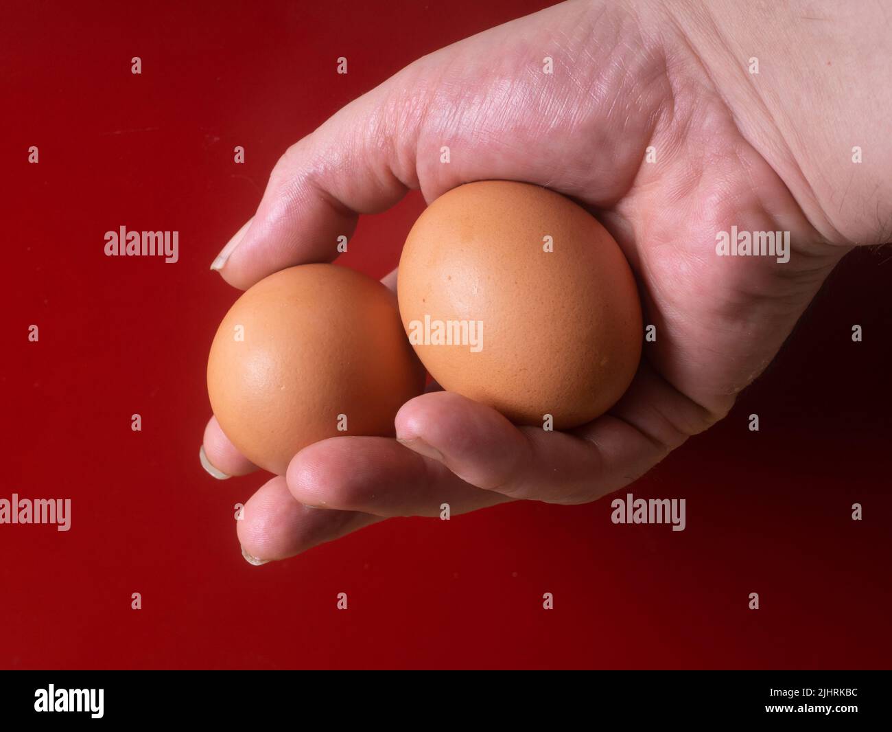 2 Eggs In A Male Hand Stock Photo