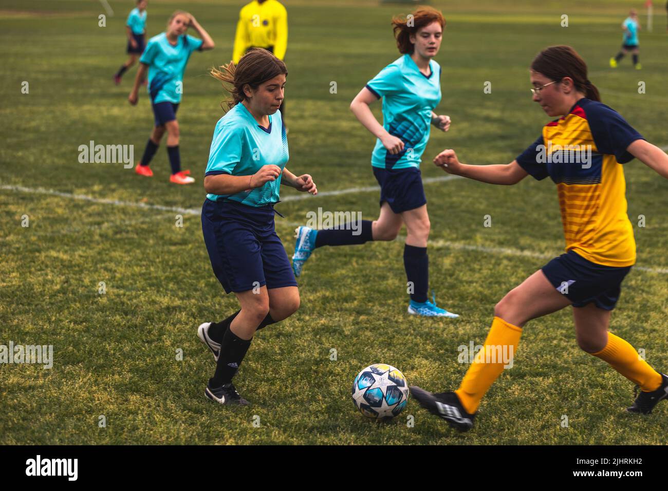 The young girls playing soccer at Youth Soccer Game Stock Photo Alamy