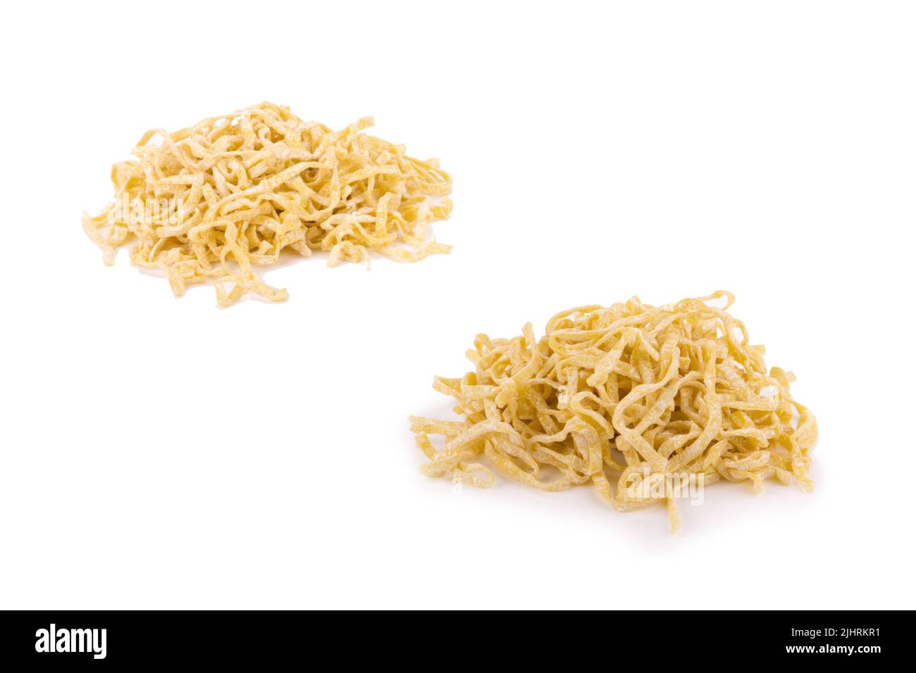 Yellow noodles drying isolated on white background Stock Photo Alamy