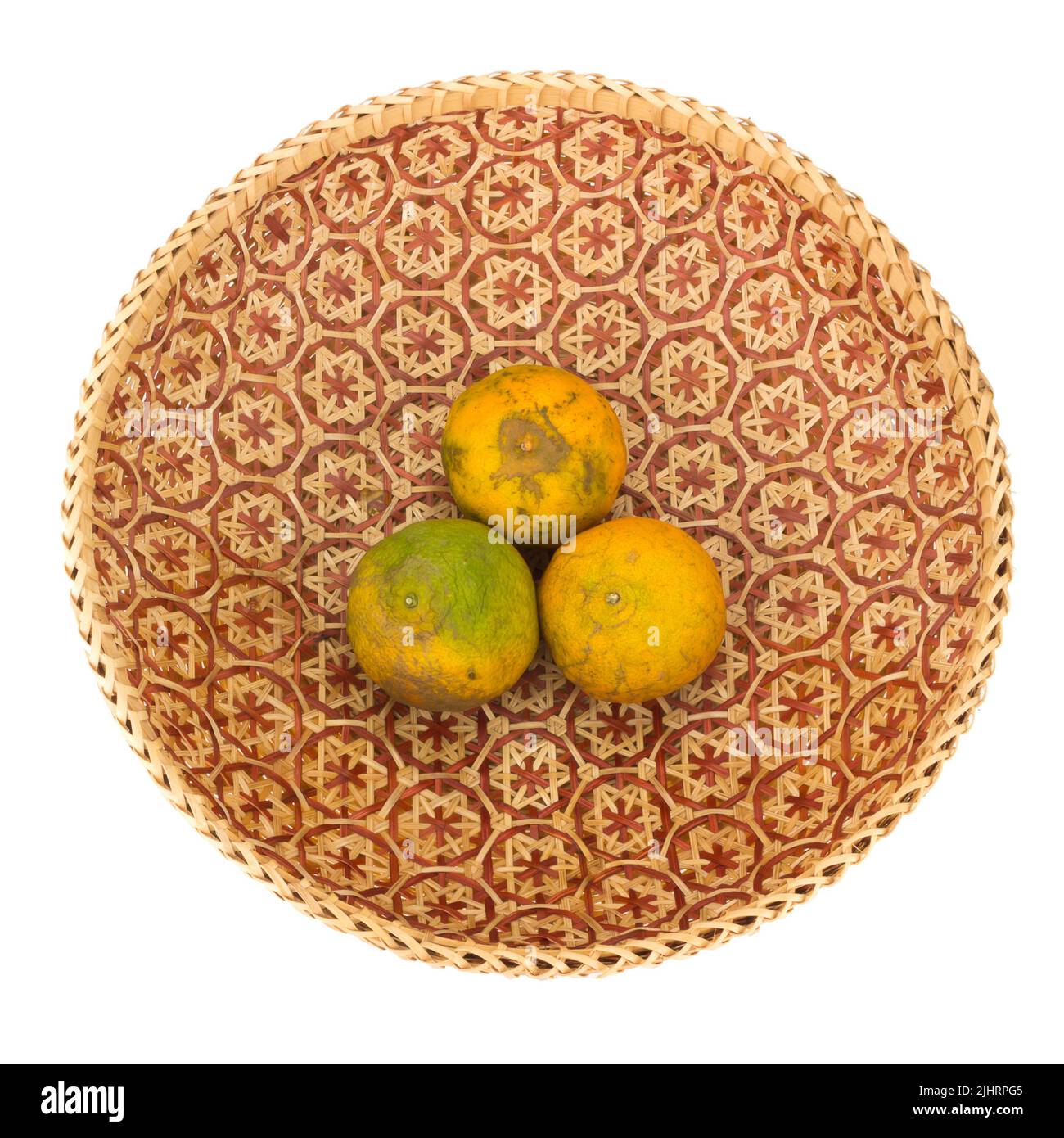 tangerine in wicker baskets isolated on white background. Stock Photo