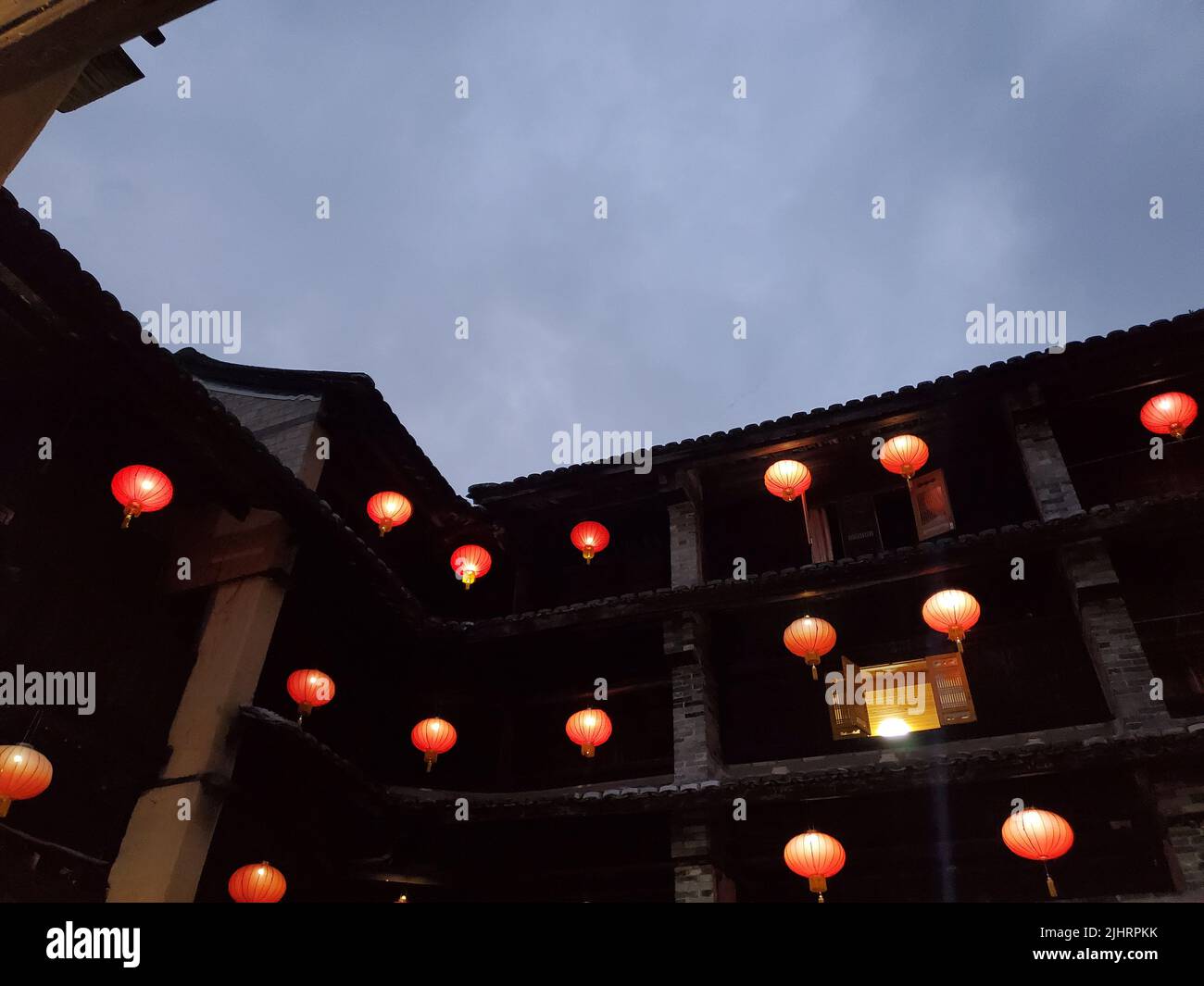 The traditional Chinese style lanterns inside Fujian tulou rectangular building in Fujian, China Stock Photo