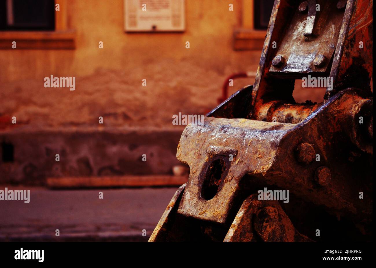 An old steel rusted tractor part, rusty metal texture, on background of ...