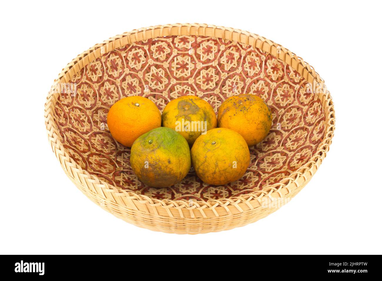 tangerine in wicker baskets isolated on white background. Stock Photo
