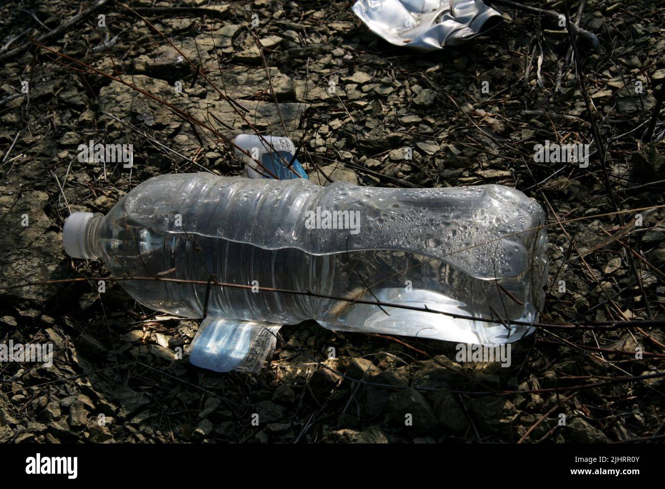 Top view of used water plastic bottles lying on the ground in Ciamis