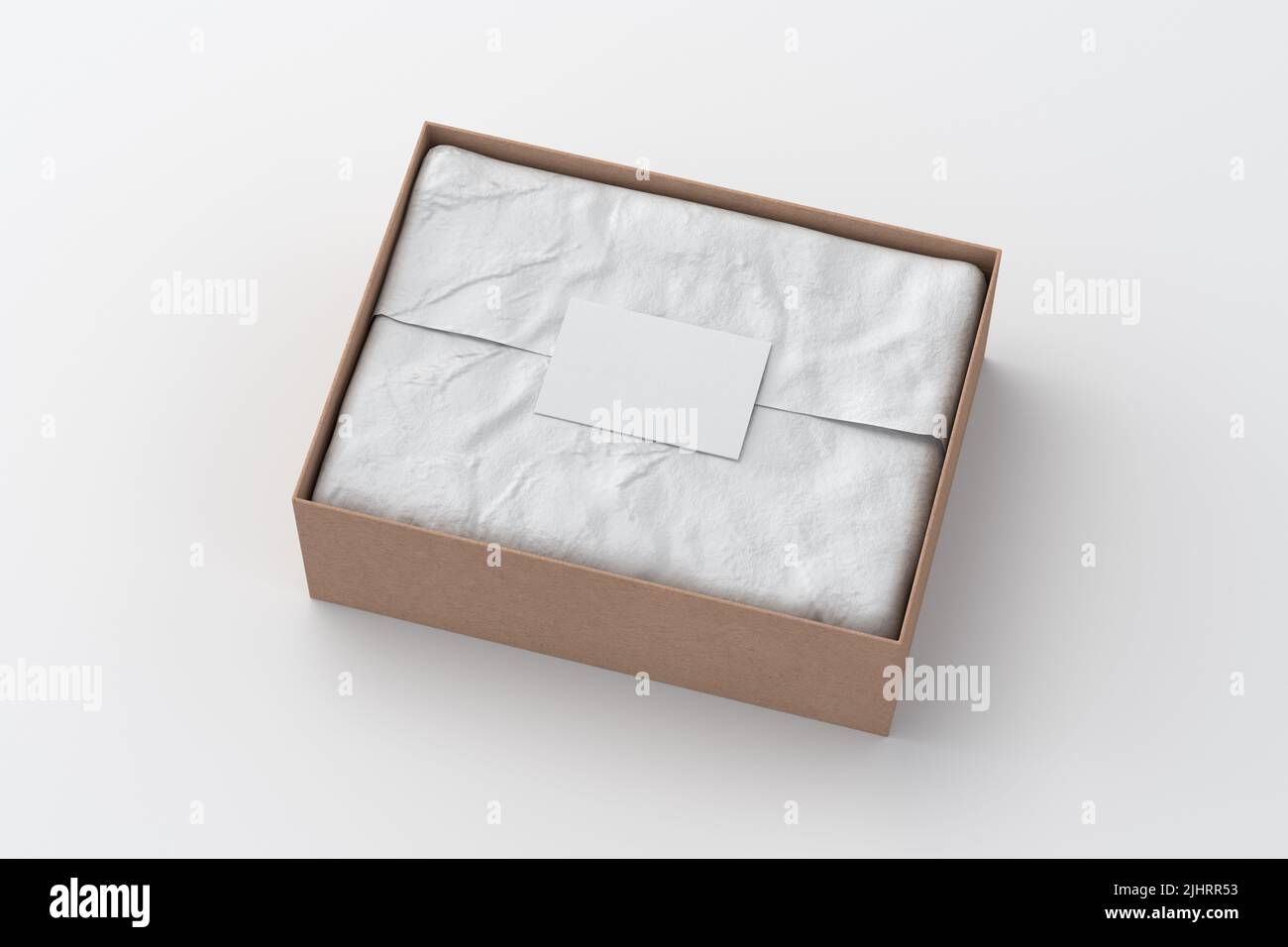 Gift box mock up. Cardboard gift box with blank label or business card on wrapping paper. White background. Side view. 3d illustration Stock Photo