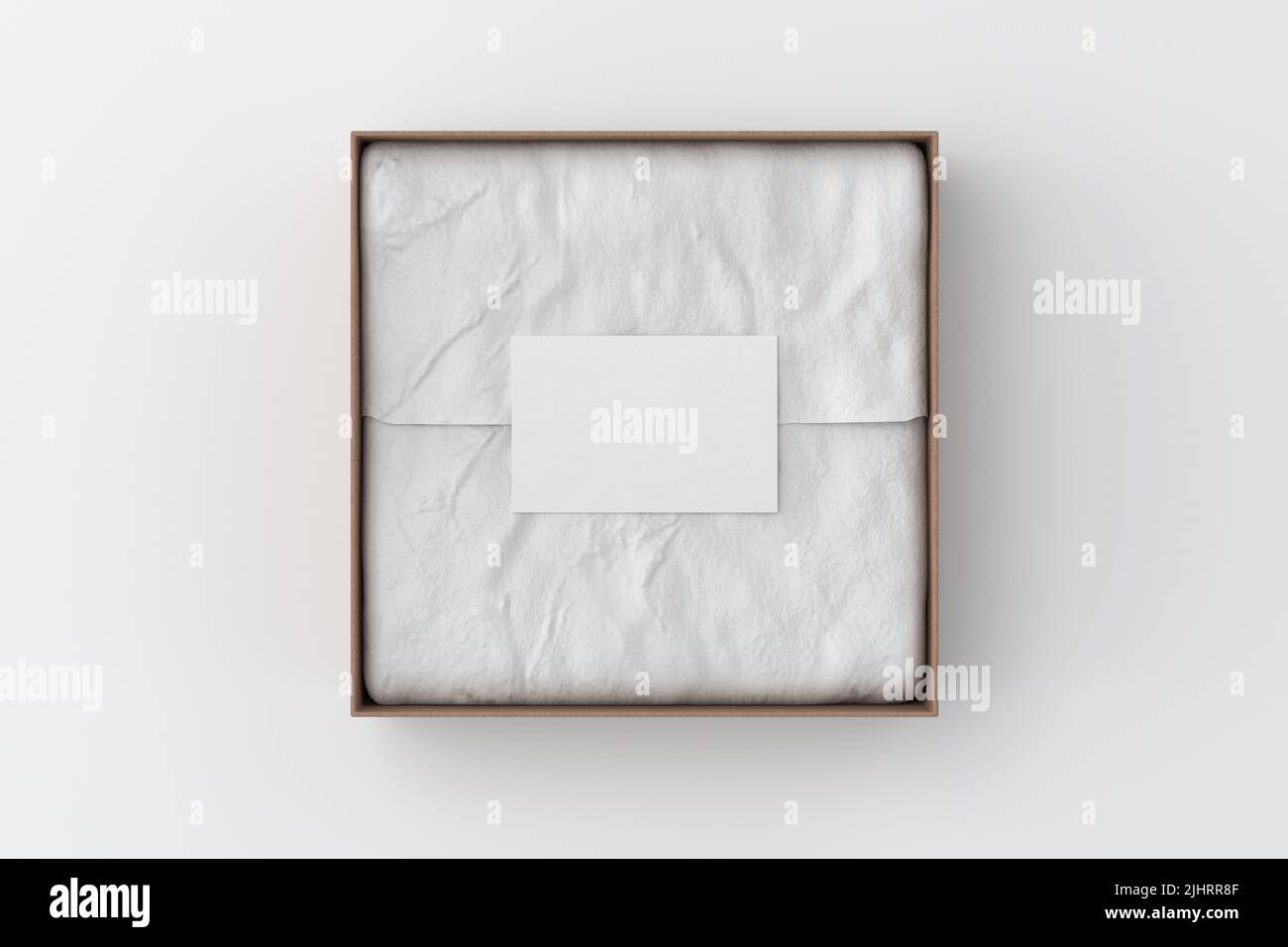 Square gift box mock up. Cardboard gift box with blank label or business card on wrapping paper. White background. View directly above. 3d illustratio Stock Photo